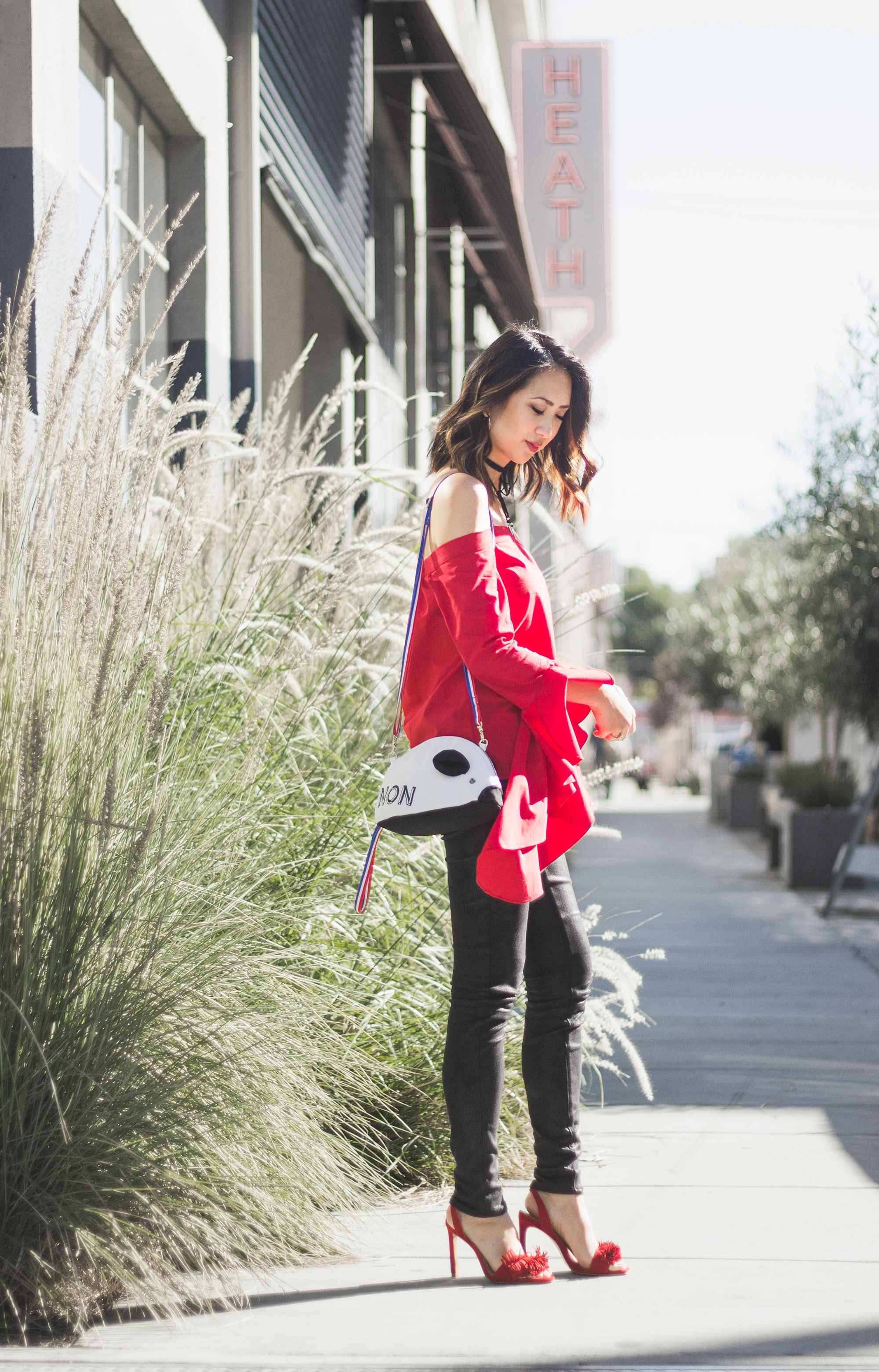 red off the shoulder top patricia chang french mouse bag