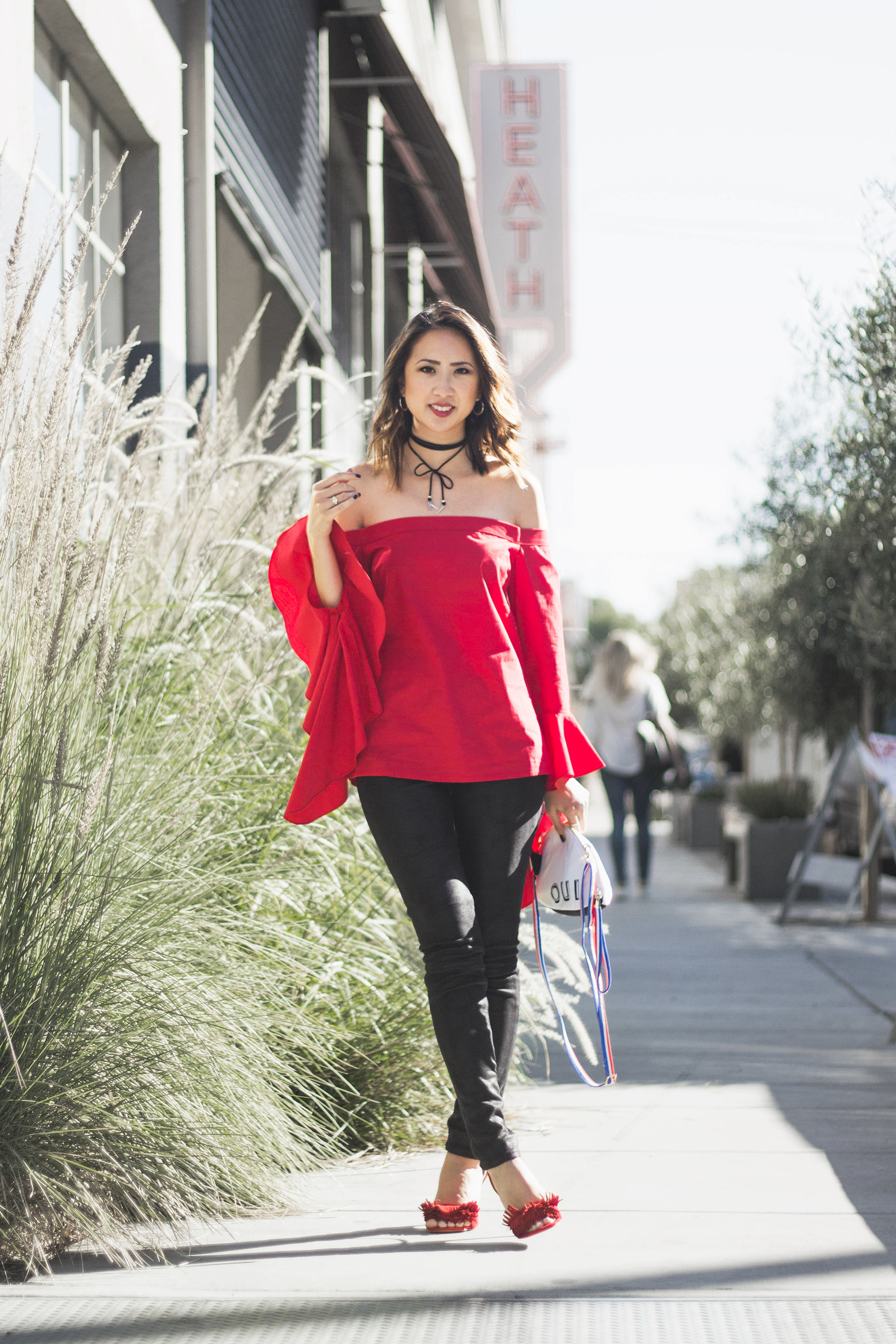 red off the shoulder top patricia chang french mouse bag